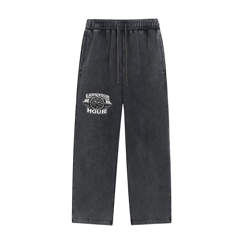 Iron Hour charcoal grey 100% cotton washed sweatpants with drawstring and "EARN YOUR HOUR" graphic print.